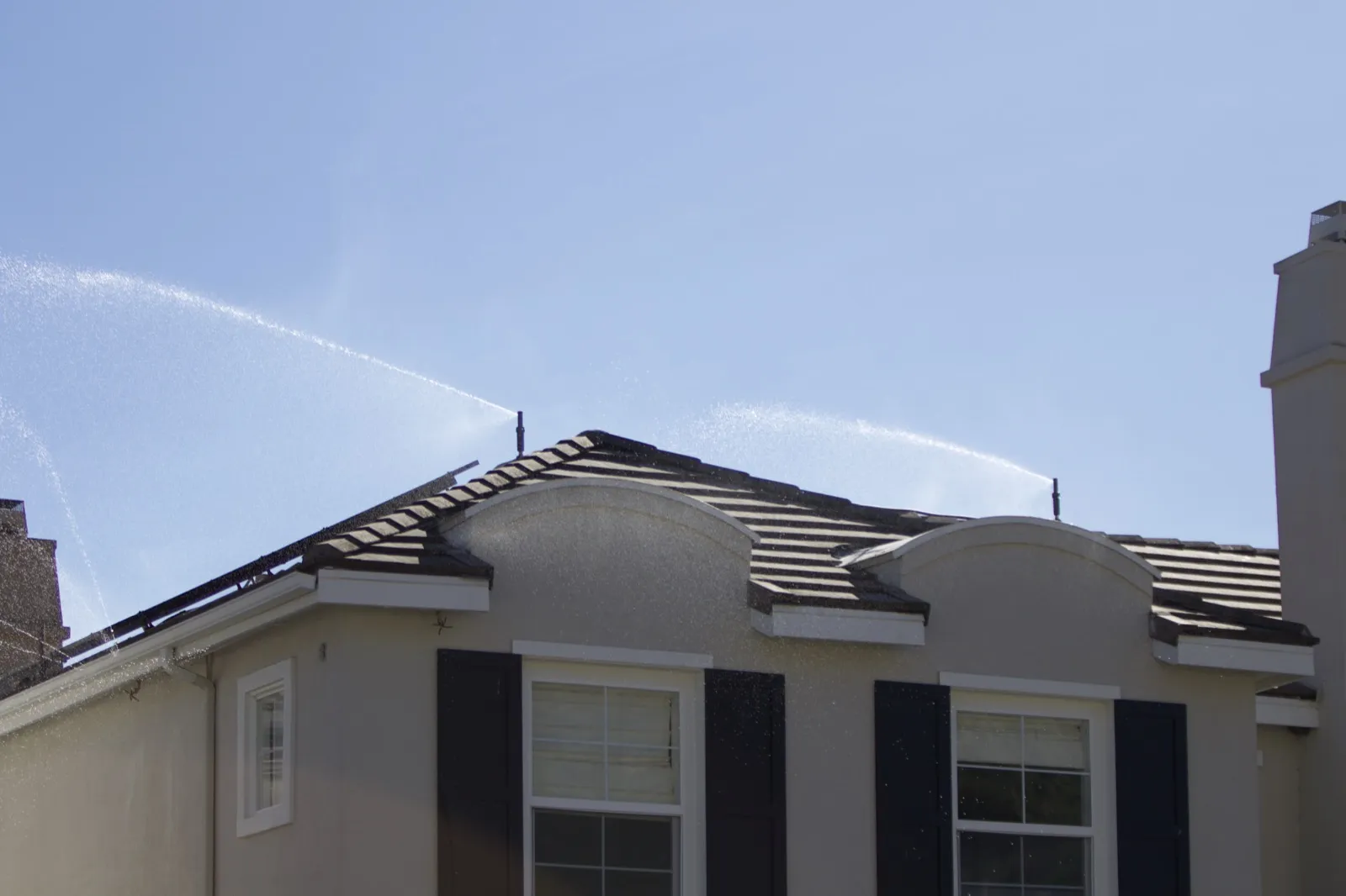 Trident sprinklers running on a home